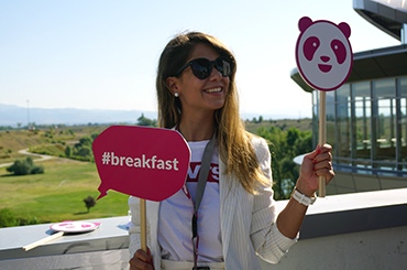 photo of milena holding panda logo and breakfast sign