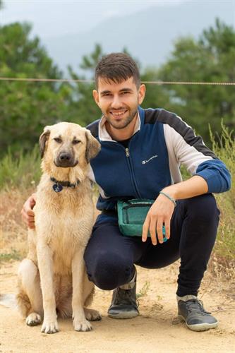 photo of valentin, a telerik academy alpha graduate, now a software engineer at tick42, with his dog
